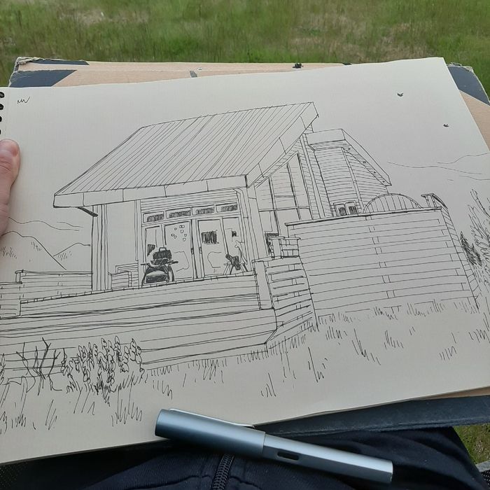 Eine Zeichnung unseres Ferienhauses mit Füller im Vordergrund